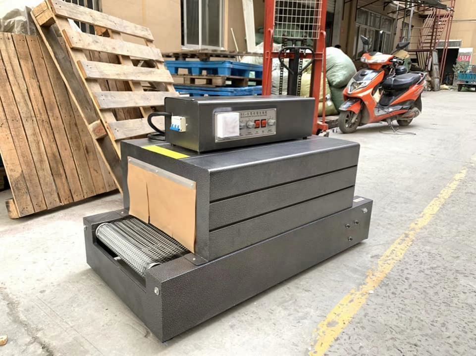 Hot Sale Small Plastic Film Heat Tunnel Shrink Cutting Packaging Machine for Bottle/box Easy Operate